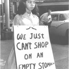 Photo of girl holding a civil rights sign